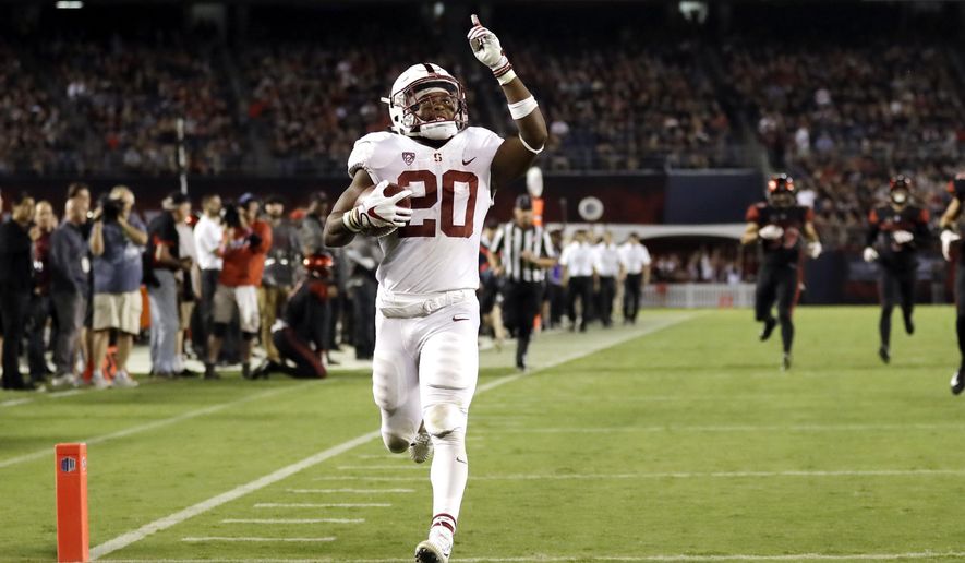 FILE - In this Sept. 16, 2017, file photo, Stanford running back Bryce Love scores a touchdown during the second half of an NCAA college football game against San Diego State in San Diego. He leads the nation in rushing at 196.75 yards per game and is averaging 10.78 yards per carry. In each game this season, Love has broken off a run of 50 yards or more. (AP Photo/Gregory Bull, File)