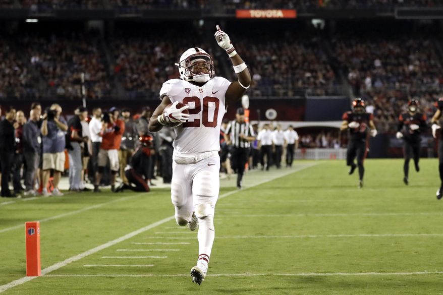 FILE - In this Sept. 16, 2017, file photo, Stanford running back Bryce Love scores a touchdown during the second half of an NCAA college football game against San Diego State in San Diego. He leads the nation in rushing at 196.75 yards per game and is averaging 10.78 yards per carry. In each game this season, Love has broken off a run of 50 yards or more. (AP Photo/Gregory Bull, File)