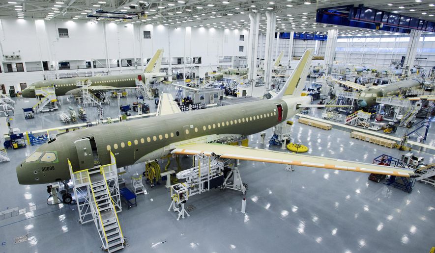 FILE- In this Dec. 18, 2015, file photo, Bombardier&#39;s CS100 assembly line is seen at the company&#39;s plant in Mirabel, Quebec, Canada. The U.S Commerce Department slapped duties of nearly 220 percent on Canada&#39;s Bombardier C Series aircraft Tuesday, Sept. 26, 2017, in a victory for Boeing that is likely to raise tensions between the United States and its allies Canada and Britain. (Ryan Remiorz/The Canadian Press via AP)