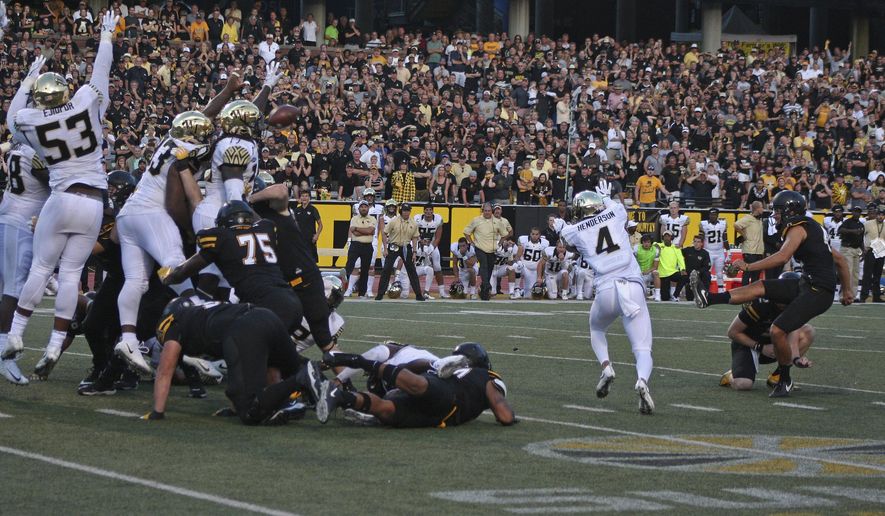 Wake Forest players attempt to block a game-winning field goal attempt by Appalachian State's Michael Rubino (41) in the final seconds of the second half of an NCAA college football game in Boone, N.C., Saturday, Sept. 23, 2017. The kick was no good. Wake Forest won 20-19. (AP Photo/Sarah Newell)