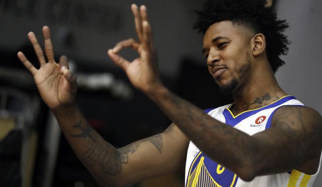 FILE - In this Friday, Sept. 22, 2017, file photo, Golden State Warriors&#x27; Nick Young gestures during the NBA basketball team&#x27;s media day in Oakland , Calif. When Young passed up a couple of shots, he heard about it, from teammate Andre Iguodala and coach Steve Kerr. The Warriors want the guard to do his thing and shoot, and young hopes to help his new team win another title, even as a role player. (AP Photo/Marcio Jose Sanchez, File)