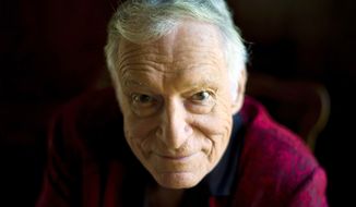 This Oct. 13, 2011, file photo shows  American magazine publisher, founder and Chief Creative Officer of Playboy Enterprises Hugh Hefner at his home at the Playboy Mansion in Beverly Hills, Calif. (AP Photo/Kristian Dowling) ** FILE **