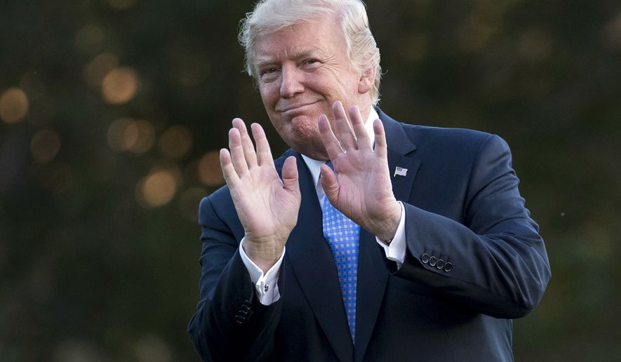 President Donald Trump gestures as he walks from Marine One across the South Lawn of the White House in Washington, Wednesday, Sept. 27, 2017, as he returns from Indianapolis. (AP Photo/Carolyn Kaster)