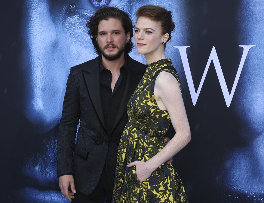 FILE - In this July 12, 2017, file photo, Kit Harington, left, and Rose Leslie arrive at the LA Premiere of "Game of Thrones" at The Walt Disney Concert Hall in Los Angeles. The couple announced their engagement in the Times of London newspaper on Sept. 27, 2017. (Photo by Willy Sanjuan/Invision/AP, File)