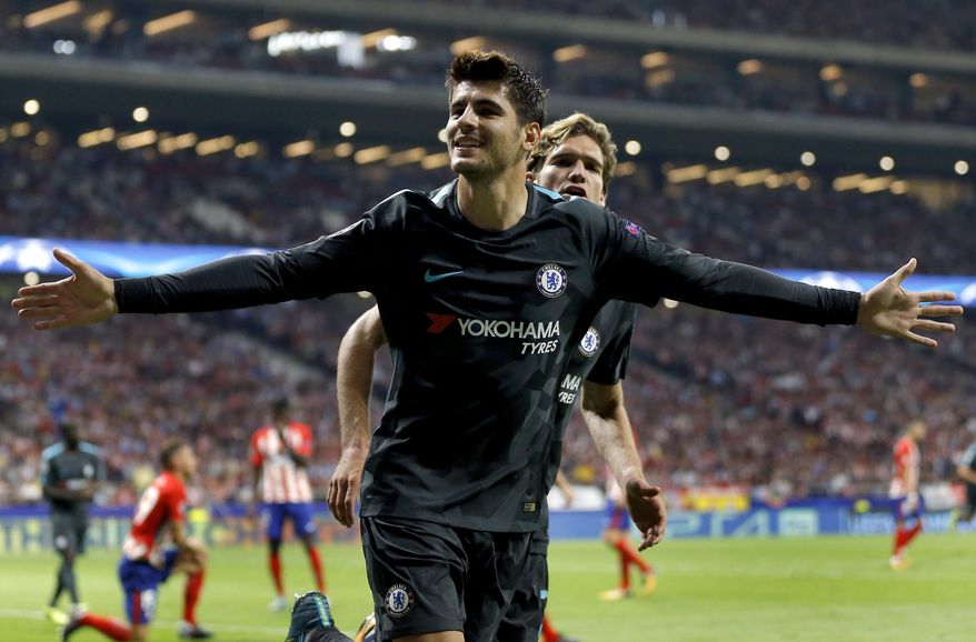 Chelsea's scorer Alvaro Morata, front, and his teammate Marcos Alonso, rear, celebrate their side's first goal during a Champions League group C soccer match between Atletico Madrid and Chelsea at the Wanda Metropolitano stadium in Madrid, Spain, Wednesday, Sept. 27, 2017. (AP Photo/Francisco Seco)