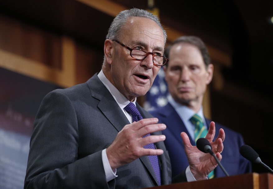 Senate Minority Leader Chuck Schumer of N.Y., and Sen. Ron Wyden, D-Ore., discuss the Republican tax plan during a news conference on Capitol Hill in Washington, Wednesday, Sept. 27, 2017. (AP Photo/Pablo Martinez Monsivais)