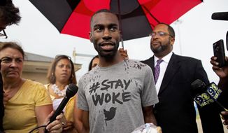 In this file photo, Black Lives Matter activist DeRay Mckesson talks to the media after his release from the Baton Rouge jail in Baton Rouge, Louisiana, July 10, 2016. (AP Photo/Max Becherer) ** FILE **