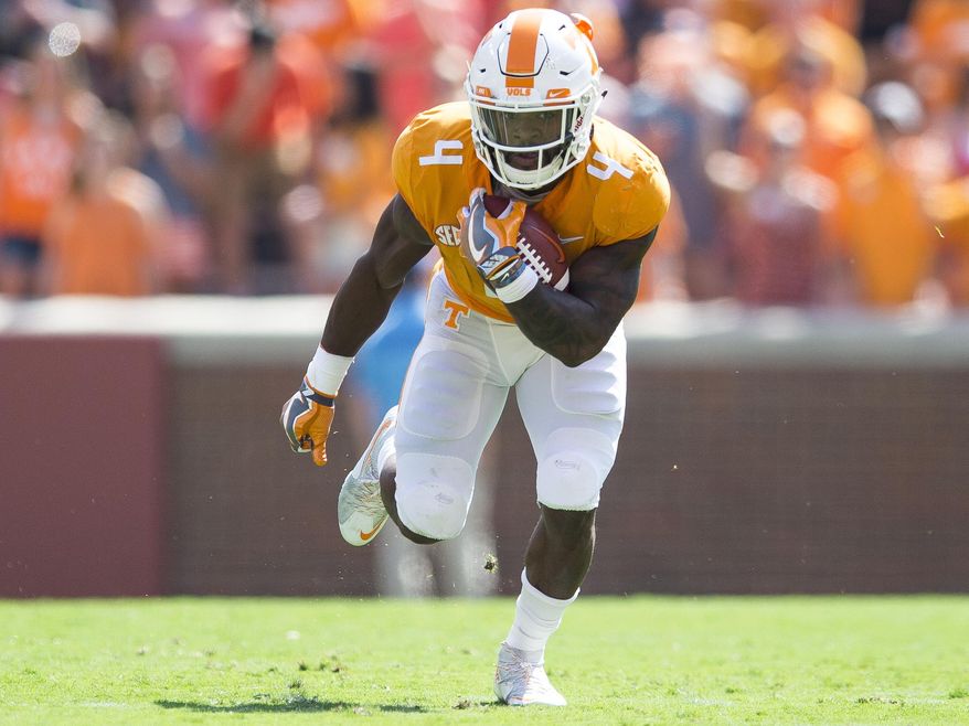 Tennessee running back John Kelly (4) runs downfield against Massachusetts during an NCAA college football game, Saturday, Sept. 23, 2017, in Knoxville, Tenn. (Clavin Mattheis/Knoxville News Sentinel via AP)