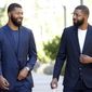 FILE in this Sept. 19, 2017 file photo, NBA players Markieff, left, and Marcus Morris arrive at Superior Court for the second day of their aggravated assault trial in Phoenix.  Jurors are expected to hear closing arguments Thursday, Sept. 28,  for the assault trial of the NBA players.  The Morris brothers are accused of helping three other people beat Erik Hood on Jan. 24, 2015. (AP Photo/Matt York, File) **FILE**