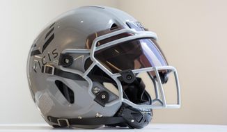 In this Sept. 11, 2017 photo a  VICIS Zero1 helmet is displayed in New York. The helmet that performed best in NFL testing this year is being used by 50 players spread across only half of the NFL teams.  (AP Photo/Mark Lennihan)