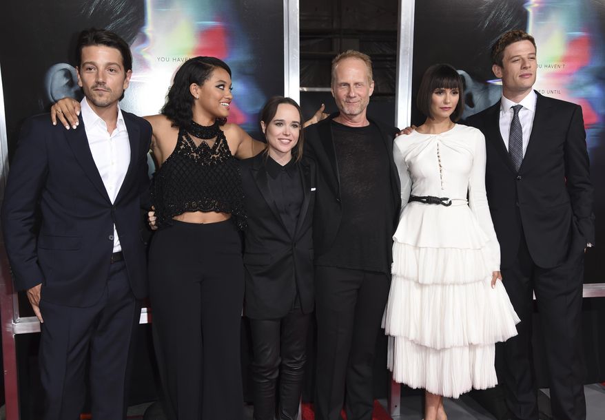 Diego Luna, from left, Kiersey Clemons, Ellen Page, director Niels Arden Oplev, Nina Dobrev and James Norton arrive at the world premiere of "Flatliners" at The Theatre at Ace Hotel on Wednesday, Sept. 27, 2017, in Los Angeles. (Photo by Richard Shotwell/Invision/AP)