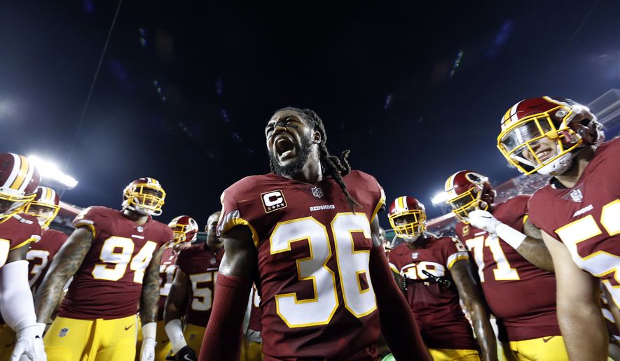 FILE - In this Sunday, Sept. 24, 2017, file photo, Washington Redskins free safety D.J. Swearinger (36) motivates his team in the huddle before an NFL football game against the Oakland Raiders in Landover, Md. What's the difference in the Redskins' defense that was ranked 28th in the NFL the past two seasons? New players. Better players. Safety D.J. Swearinger and linebacker Zach Brown are among the newcomers reshaping the Redskins' defense far earlier than expected.(AP Photo/Alex Brandon, File)