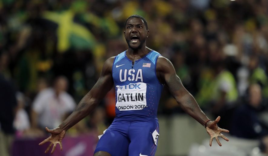 FILE - In this Aug. 5, 2017 file photo, United States' Justin Gatlin celebrates after crossing the line to win the gold medal in the men's 100m final during the World Athletics Championships in London. World sprint champion Gatlin says he won't be taking the knee in protest this weekend at an exhibition race in Brazil. Asked about it before Sunday's race, Gatlin says, "I'm going to stand up. I mean, I'm going to stand up. I'm not saying if I take the knee or stand, I'm not for the protests." (AP Photo/Tim Ireland, File)