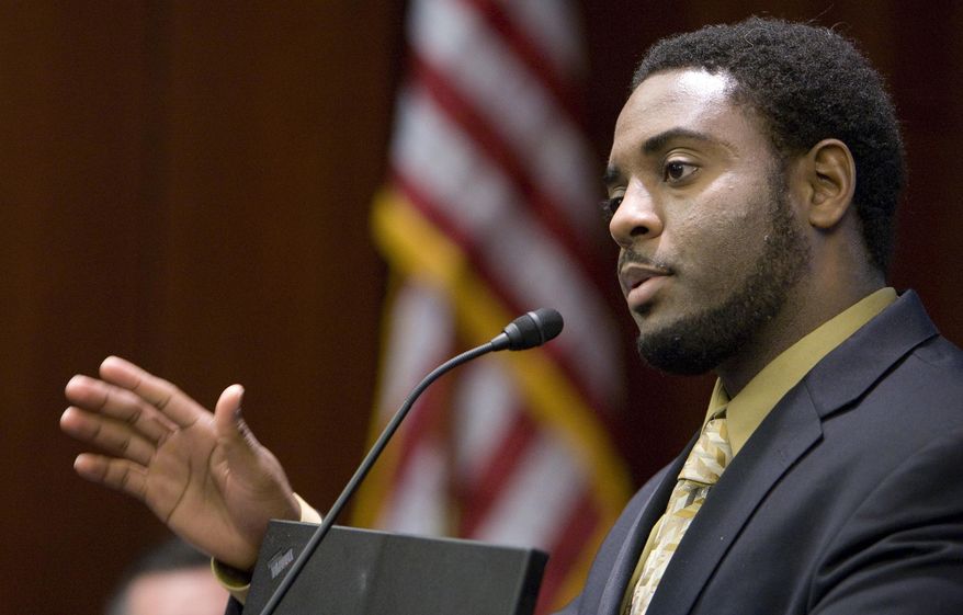 FILE - In this Nov. 5, 2009 file photo, Reginald Dwayne Betts, writing workshop program director, speaks during a school forum on Capitol Hill in Washington. Betts, a convicted felon who graduated from Yale Law School and won acclaim as a poet, was admitted to the state bar Friday, Sept. 29, 2017, by the Connecticut Bar Examining Committee. The panel previously had flagged his file after he passed the bar exam to investigate whether he lacked "good moral character and/or fitness to practice law." (AP Photo/Alex Brandon, File)