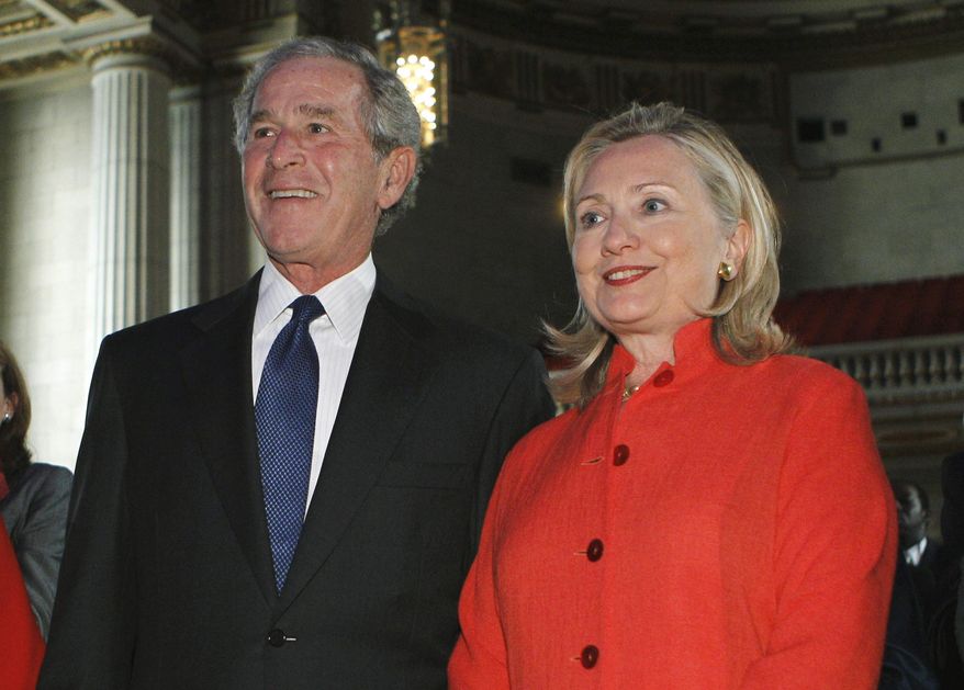 FILE - In this Sept. 13, 2011 file photo former President George W. Bush and then Secretary of State Hillary Rodham Clinton attend a ceremony to announce the combating of cervical and breast cancer in developing nations in Washington. Bush is helping his former White House senior adviser raise money in the closely watched Virginia governor's race. An invitation obtained by The Associated Press shows Bush will headline a fundraiser for Ed Gillespie on Oct. 16, 2017, in Alexandria. On the Democratic side, Lt. Gov. Ralph Northam has a scheduled fundraiser with Clinton in New York next week. (AP Photo/Jose Luis Magana, File)