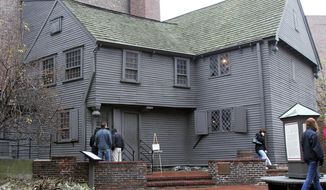 FILE - In this Nov. 24, 2004 file photo, tourists visit the Paul Revere House in the North End neighborhood of Boston. In 2017, archaeologists said they think they found where an outhouse was located next door to Revere&#39;s house in the yard of the Pierce-Hichborn House. Experts say the house, built next to Revere&#39;s house in 1711, was owned by one of Revere&#39;s cousins, and the renowned American patriot himself likely visited on numerous occasions. (AP Photo/Chitose Suzuki, File)