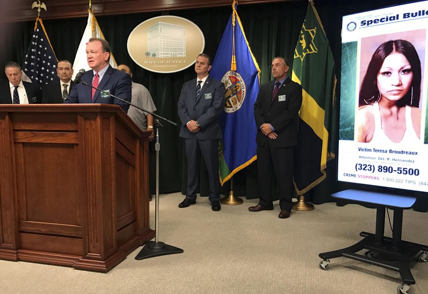 Los Angeles County Sheriff Jim McDonnell, at podium, discusses the arrest of a man on suspicion of killing a pregnant woman whose nude body was found on a beach in 1980, at a news conference in downtown Los Angeles Friday, Sept. 29, 2017. McDonnell said detectives arrested 65-year-old Robert Yniguez outside his home in the San Pedro area of Los Angeles Thursday. He is suspected of killing 20-year-old Teresa Boudreaux, seen at right, whose body was found on the shoreline of Malaga Cove Beach in Palos Verdes Estates in March, 1980. Sheriff's officials say Yniguez's DNA was linked to evidence that had been collected at the crime scene. (AP Photo/Michael Balsamo)