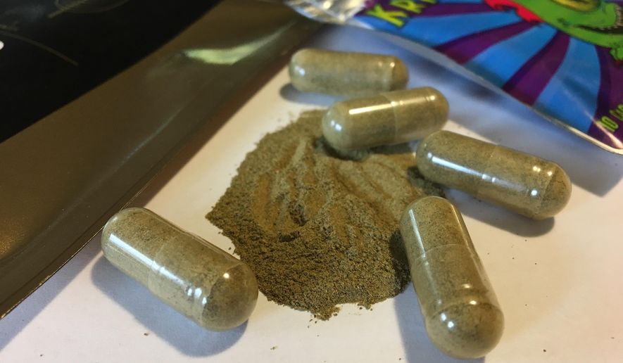 In this Sept. 27, 2017 photo, kratom capsules are displayed in Albany, N.Y. An upstate New York coroner’s classification of a young police sergeant’s death as a kratom overdose has sparked controversy among advocates of the herbal supplement who fear it could fuel efforts to ban it. Sgt. Matt Dana died in August 2017 at his home in Tupper Lake. A month later, the coroner said a toxicology study found only a high level of kratom in his blood. He said the 27-year-old officer died of hemorrhagic pulmonary edema, blood and fluid in the lungs. (AP Photo/Mary Esch)