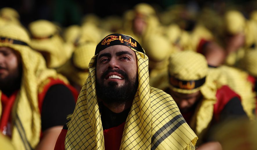 Lebanese Shiite supporters of Hezbollah cry as listen to the story of Imam Hussein, during activities marking the holy day of Ashoura, in southern Beirut, Lebanon, Sunday, Oct. 1, 2017. Ashoura is the annual Shiite Muslim commemoration marking the death of Imam Hussein, the grandson of the Prophet Muhammad, at the Battle of Karbala in present-day Iraq in the 7th century. (AP Photo/Hassan Ammar)