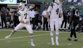 New York Jets kicker Chandler Catanzaro, left, reacts after hitting the game winning field goal during the overtime period of an NFL football game against the Jacksonville Jaguars, Sunday, Oct. 1, 2017, in East Rutherford, N.J. The Jets defeated the Jaguars 23-20. (AP Photo/Bill Kostroun)