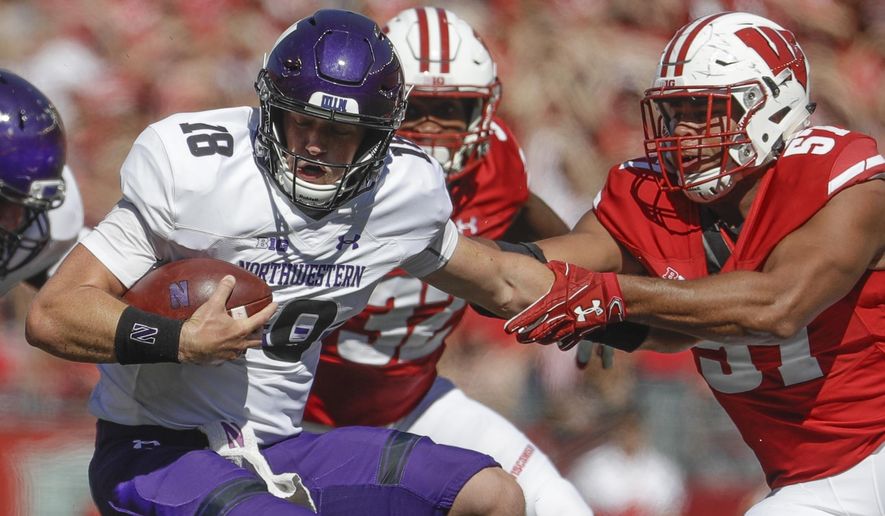 Wisconsin's Alec James sacks Northwestern's Clayton Thorson during the second half of an NCAA college football game Saturday, Sept. 30, 2017, in Madison, Wis. Wisconsin won 33-24. (AP Photo/Morry Gash)
