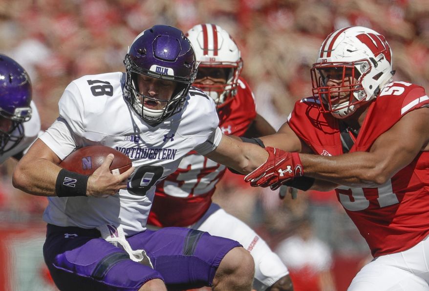 Wisconsin's Alec James sacks Northwestern's Clayton Thorson during the second half of an NCAA college football game Saturday, Sept. 30, 2017, in Madison, Wis. Wisconsin won 33-24. (AP Photo/Morry Gash)