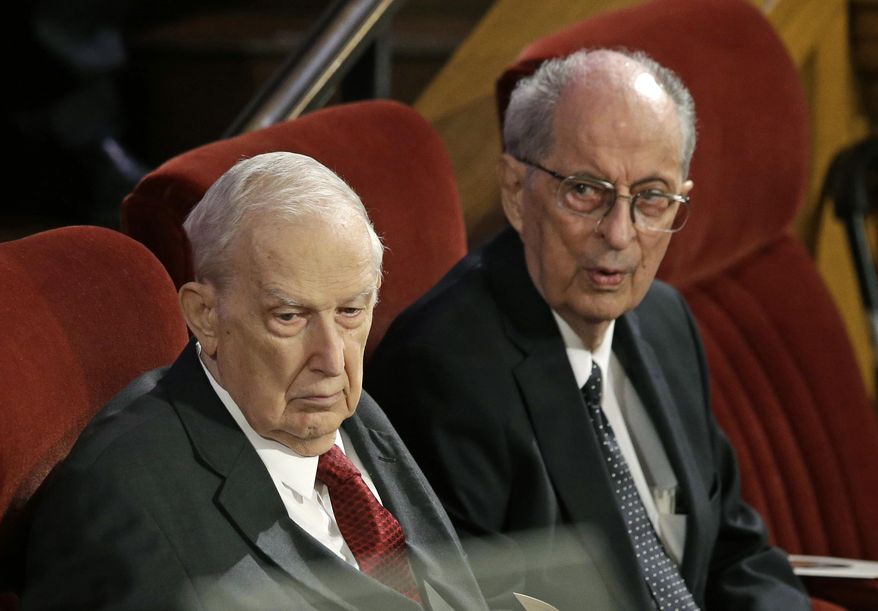 FILE - This July 10, 2015, file photo, shows Senior Mormon leader Robert D. Hales, right, and Richard G. Scott, left, attending the memorial service for Mormon leader Boyd K. Packer at the Tabernacle on Temple Square in Salt Lake City. Senior Mormon leader Robert D. Hales has died at the age of 85. Church spokesman Eric Hawkins said in a statement that Hales died Sunday, Oct. 1, 2017, in a Salt Lake City hospital surrounded by his wife and family. (AP Photo/Rick Bowmer, File)