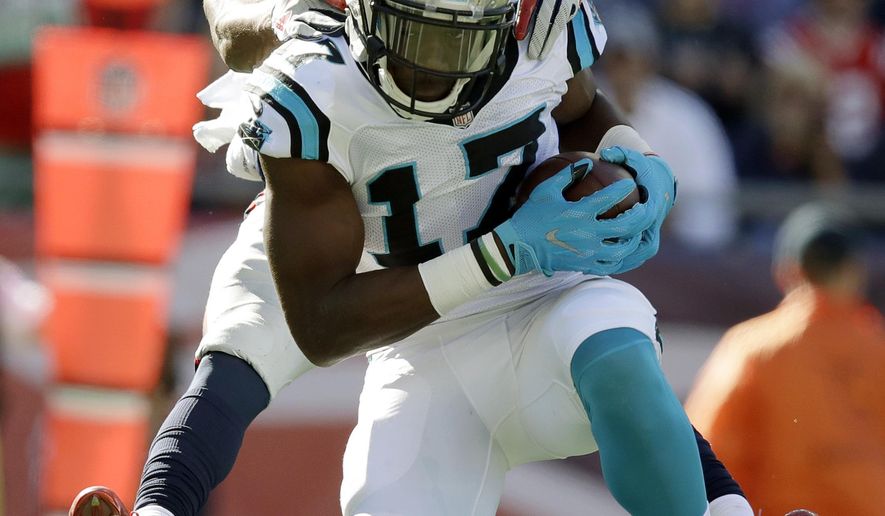 Carolina Panthers wide receiver Devin Funchess (17) catches a pass for a touchdown as New England Patriots cornerback Malcolm Butler, rear, defends during the second half of an NFL football game against the New England Patriots, Sunday, Oct. 1, 2017, in Foxborough, Mass. (AP Photo/Charles Krupa)