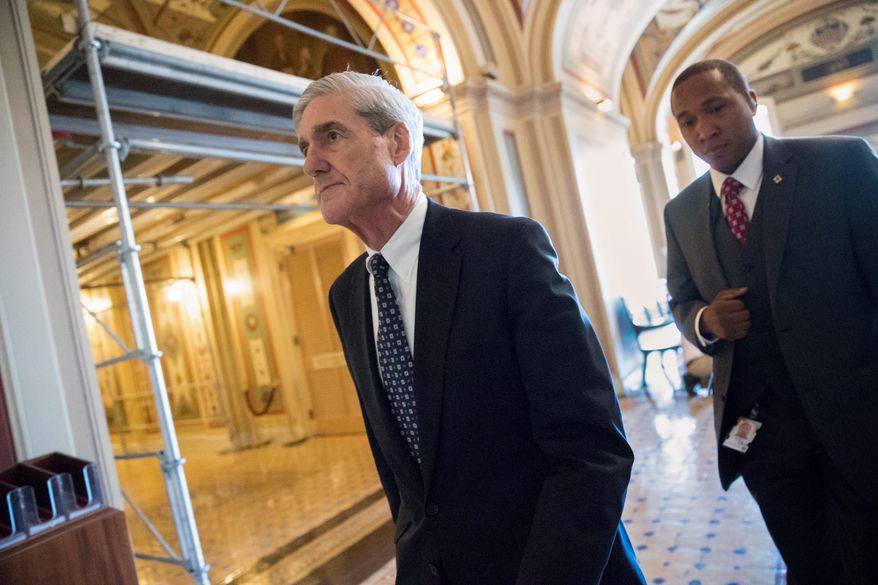 Special counsel Robert Mueller is reported to have his first indictment from a federal grand jury in Washington, and the target could be taken into custody as soon as Monday. (Associated Press/File)