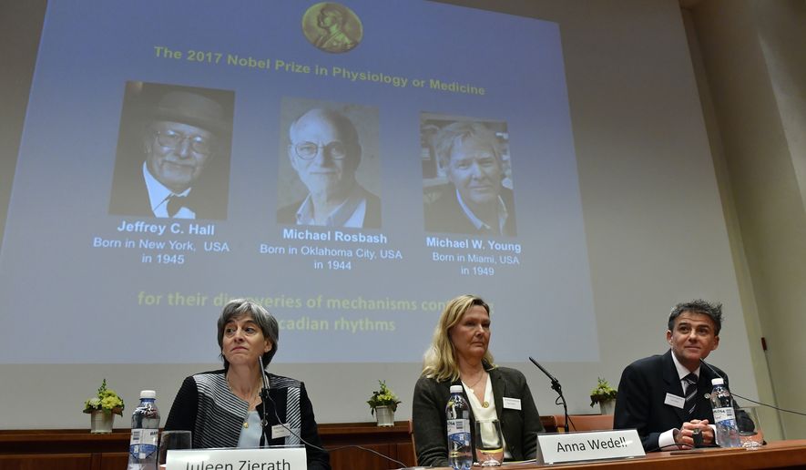 Anna Wedell, chairman of the Nobel committee, center, and members of the committee Juleen Zierath, left, and Carlos Ibanez, announce the winners of the 2017 Nobel Prize for Medicine during a press conference at the Nobel Forum in Stockholm, Monday Oct. 2, 2017. The Nobel Prize for Medicine has been awarded to three Americans for discoveries about the body's daily rhythms. The laureates are Jeffrey c. Hall, Michael Rosbash and Michael W. Young. (Jonas Ekstromer/TT via AP)