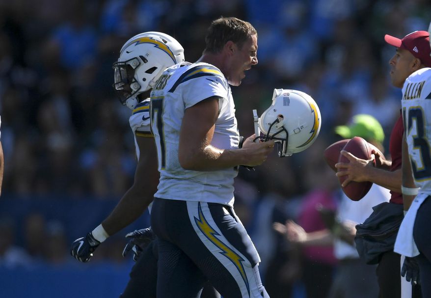 Los Angeles Chargers quarterback Philip Rivers reacts as he comes off the field during the second half of an NFL football game against the Philadelphia Eagles, Sunday, Oct. 1, 2017, in Carson, Calif. (AP Photo/Mark J. Terrill)