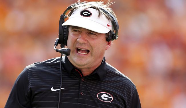 FILE - In this Saturday, Sept. 30, 2017, file photo, Georgia head coach Kirby Smart reacts during the first half of an NCAA college football game against Tennessee, in Knoxville, Tenn. Coach Smart is trying to level excitement as his unbeaten team keeps moving higher in the poll. The No. 5 Bulldogs are back at practice two days after a blowout win at Tennessee, and he wants fans to know that his team is far from perfect. (AP Photo/Wade Payne, File)