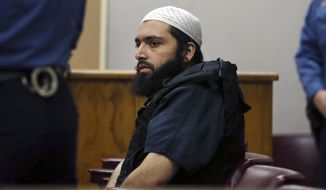 FILE - In this Dec. 20, 2016 file photo, Ahmad Khan Rahimi, the man accused of setting off bombs in New Jersey and New York&#39;s Chelsea neighborhood in September, sits in court in Elizabeth, N.J. His trial opens, Monday, Oct. 2, 2017 in New York. (AP Photo/Mel Evans, File)