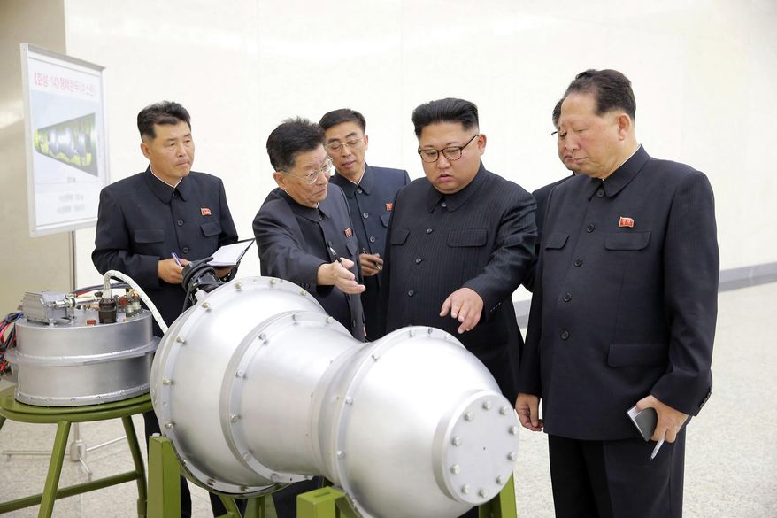 This undated file photo distributed on Sept. 3, 2017, by the North Korean government shows North Korean leader Kim Jong-un (second from right) at an undisclosed location in North Korea. (Korean Central News Agency/Korea News Service via AP) **FILE**