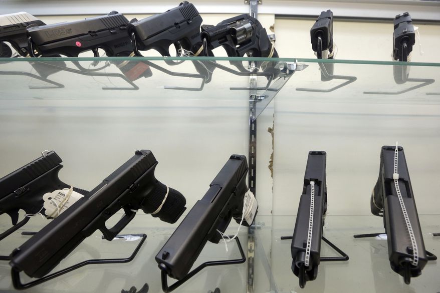 This Wednesday, June 29, 2016 file photo shows guns on display at a gun store in Miami. (AP Photo/Alan Diaz) **FILE**