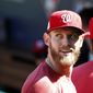 Washington Nationals starting pitcher Stephen Strasburg smiles as he walk into the dugout during practice at Nationals Park, Tuesday, Oct. 3, 2017, in Washington. Game 1 of the National League Division Series against the Chicago Cubs is Friday. (AP Photo/Alex Brandon)