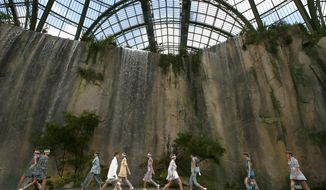 Models wear creations for the Chanel Spring/Summer 2018 ready-to-wear fashion collection presented in Paris, Tuesday, Oct., 2017. (AP Photo/Francois Mori)