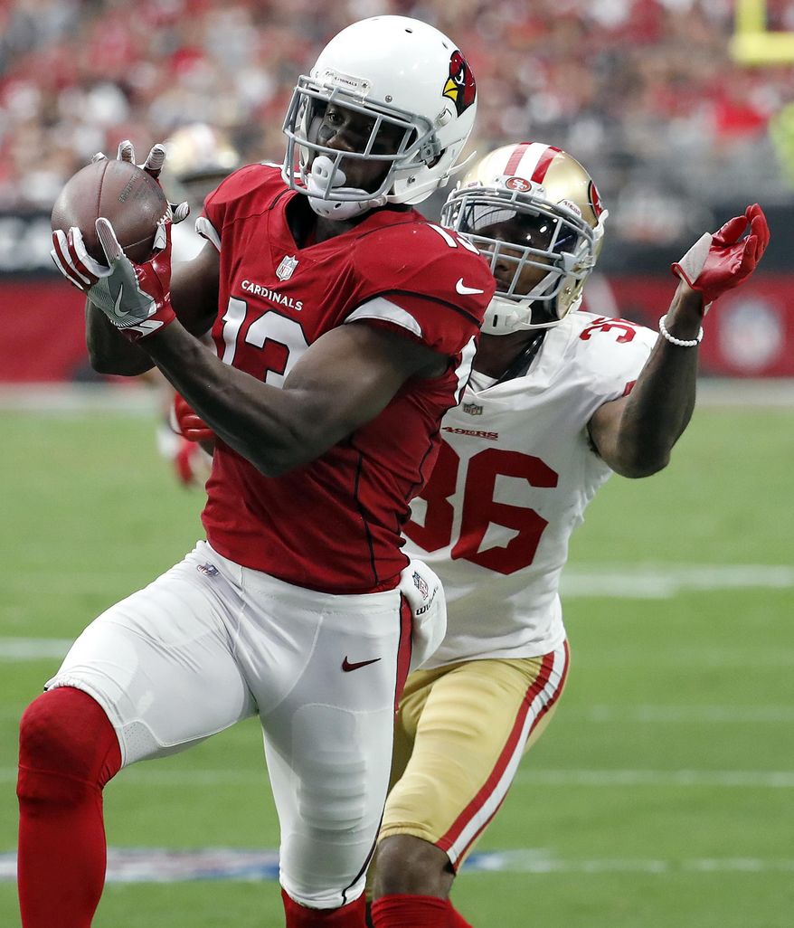 Arizona Cardinals wide receiver Jaron Brown (13) pulls in a catch as San Francisco 49ers cornerback Dontae Johnson (36) defends during the first half of an NFL football game, Sunday, Oct. 1, 2017, in Glendale, Ariz. (AP Photo/Rick Scuteri)