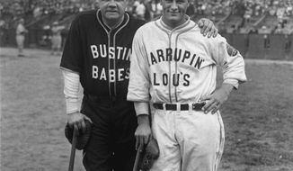 FILE - This is an October 1927 file photo showing New York Yankees stars Babe Ruth, left, and Lou Gehrig posed during an exhibition game. The sport’s most successful franchise reached mythical heights in 1927, when Ruth hit 60 home runs and did not even lead the team in total bases. That distinction went to Gehrig, who batted .373 with 47 homers, 52 doubles and 18 triples. (AP Photo/File)
