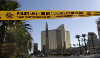 Part of Reno Ave. near South Las Vegas Blvd is blocked with police tape in the aftermath of a mass shooting Wednesday, Oct. 4, 2017, in Las Vegas. A gunman opened fire on an outdoor music concert on Sunday. It was the deadliest mass shooting in modern U.S. history, with dozens killed and hundreds injured, some by gunfire, some during the chaotic escape. (AP Photo/Marcio Jose Sanchez)