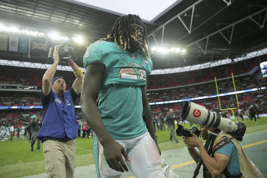 Miami Dolphins running back Jay Ajayi leaves the field after an NFL football game against the New Orleans Saints at Wembley Stadium in London, Sunday Oct. 1, 2017. The Saints won 20-0. (AP Photo/Tim Ireland)