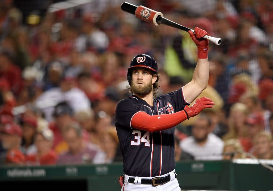 Washington Nationals' Bryce Harper warms up on deck during a baseball game against the Pittsburgh Pirates, Friday, Sept. 29, 2017, in Washington. (AP Photo/Nick Wass)