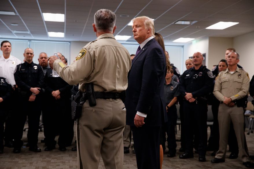 President Donald Trump listens to Clark County Sheriff Joseph Lombardo during a meeting with first responders at the Las Vegas Metropolitan Police Department, Wednesday, Oct. 4, 2017, in Las Vegas. Associated Press photo