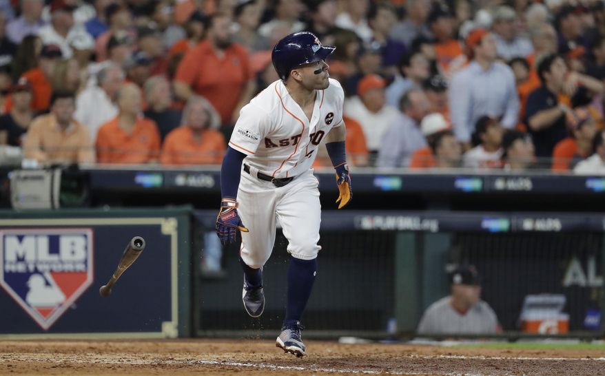 Houston Astros' Jose Altuve watches his solo home run off Boston Red Sox starting pitcher Chris Sale during the fifth inning in Game 1 of a baseball American League Division Series, Thursday, Oct. 5, 2017, in Houston. (AP Photo/David J. Phillip)