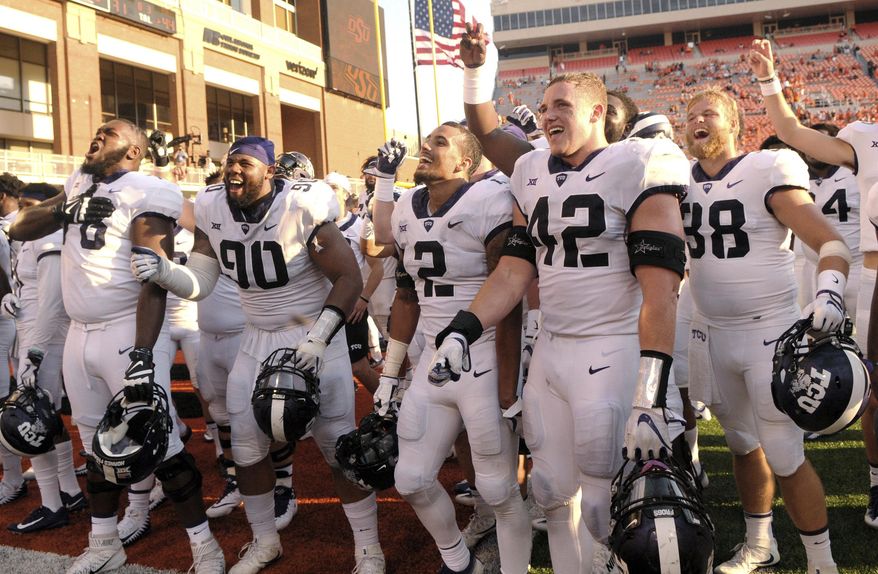 FILE - In this Sept. 23, 2017, file photo, TCU players celebrate in the end zone of Boone Pickens Stadium in Stillwater, Okla., Saturday, Sept. 23, 2017. TCU defeated Oklahoma State 44-31. TCU faces West Virginia this week; both teams are in the Top 25. (AP Photo/Brody Schmidt, File)