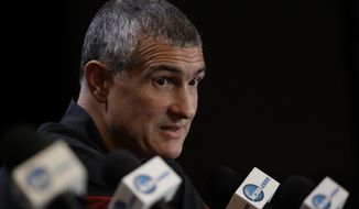 FILE - In this March 30, 2017, file photo, South Carolina head coach Frank Martin answers questions after a practice session for their NCAA Final Four tournament college basketball semifinal game, in Glendale, Ariz. Frank Martin would love to spend his time discussing how South Carolina would build on its Final Four surprise run from a year ago. Instead, he&#39;ll talk about the federal probe into college basketball which included his former asisstant Lamont Evans, who worked at South Carolina before moving to Oklahoma State. (AP Photo/David J. Phillip, File)