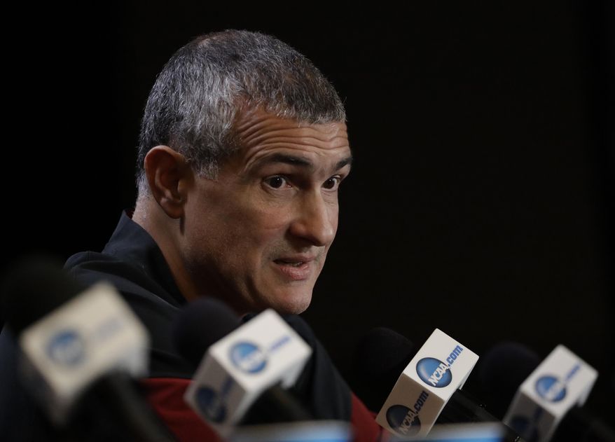 FILE - In this March 30, 2017, file photo, South Carolina head coach Frank Martin answers questions after a practice session for their NCAA Final Four tournament college basketball semifinal game, in Glendale, Ariz. Frank Martin would love to spend his time discussing how South Carolina would build on its Final Four surprise run from a year ago. Instead, he'll talk about the federal probe into college basketball which included his former asisstant Lamont Evans, who worked at South Carolina before moving to Oklahoma State. (AP Photo/David J. Phillip, File)