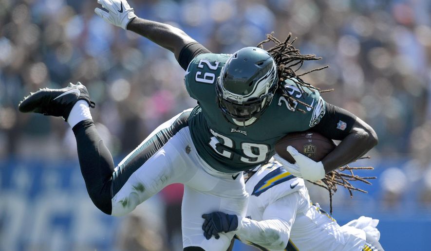 FILE - In this Sunday, Oct. 1, 2017, file photo, Philadelphia Eagles running back LeGarrette Blount (29) tries break free from Los Angeles Chargers strong safety Jahleel Addae during the first half of an NFL football game in Carson, Calif. Closing out close games is an art the Eagles are learning. After going 1-5 in games decided by a touchdown or less in 2016, the Eagles already are 2-1 in such games this season. (AP Photo/Mark J. Terrill, File)