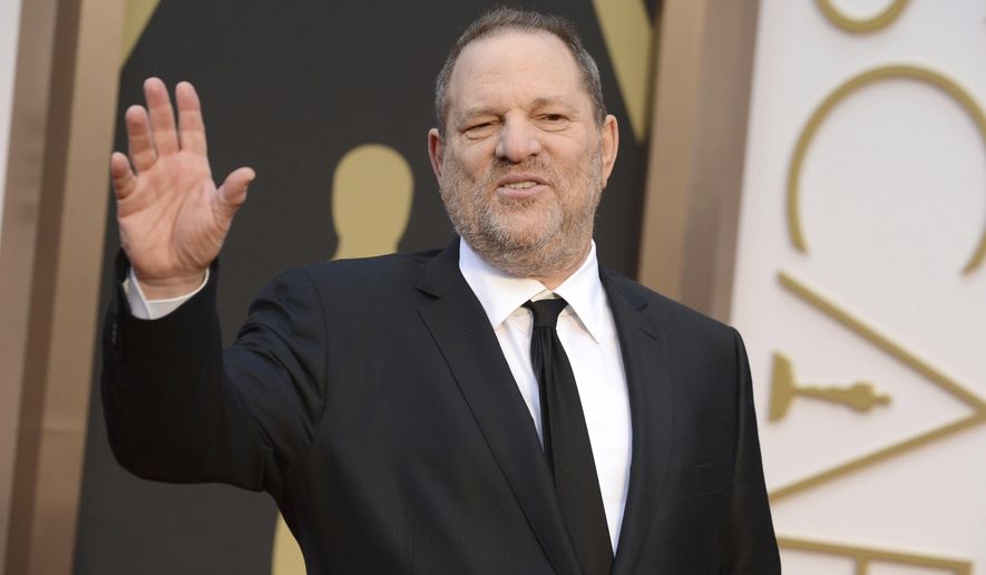 In this March 2, 2014, file photo, Harvey Weinstein arrives at the Oscars in Los Angeles. Weinstein is taking a leave of absence from his own company after The New York Times released a report alleging decades of sexual harassment against women, including employees and actress Ashley Judd. (Photo by Jordan Strauss/Invision/AP, File)