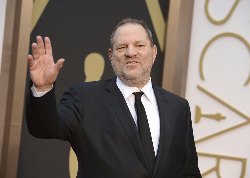In this March 2, 2014, file photo, Harvey Weinstein arrives at the Oscars in Los Angeles. Weinstein is taking a leave of absence from his own company after The New York Times released a report alleging decades of sexual harassment against women, including employees and actress Ashley Judd. (Photo by Jordan Strauss/Invision/AP, File)